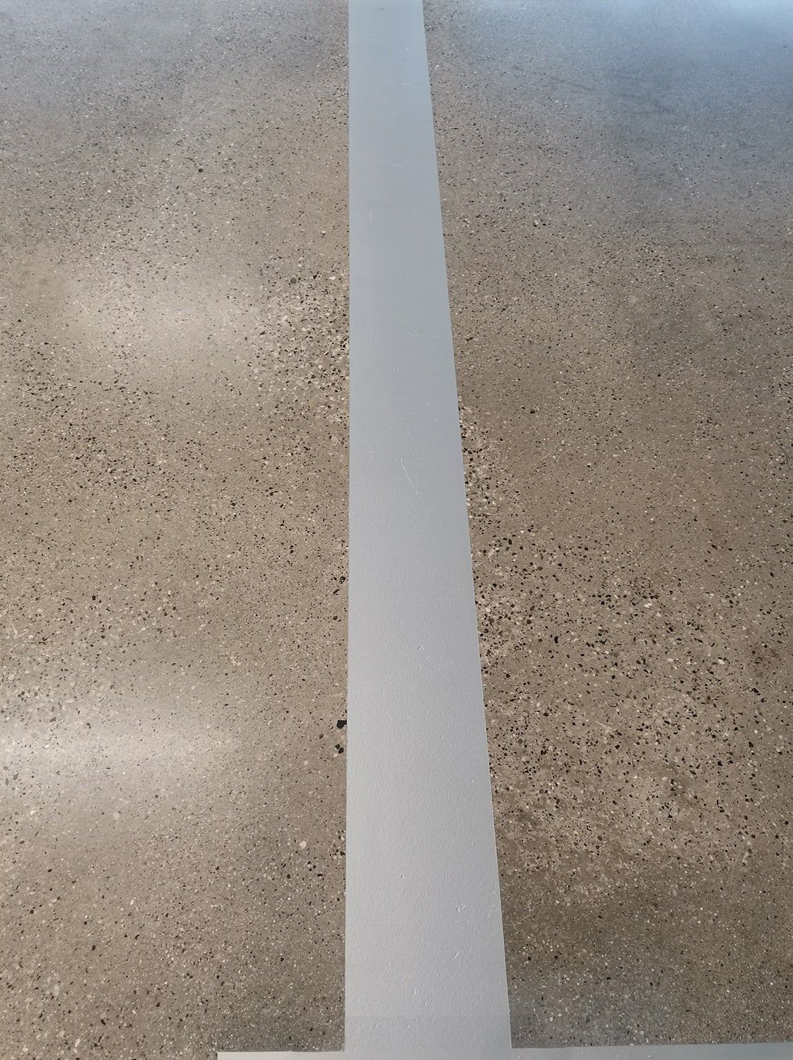After: Joint and traffic aisle: before grinding and after treatment