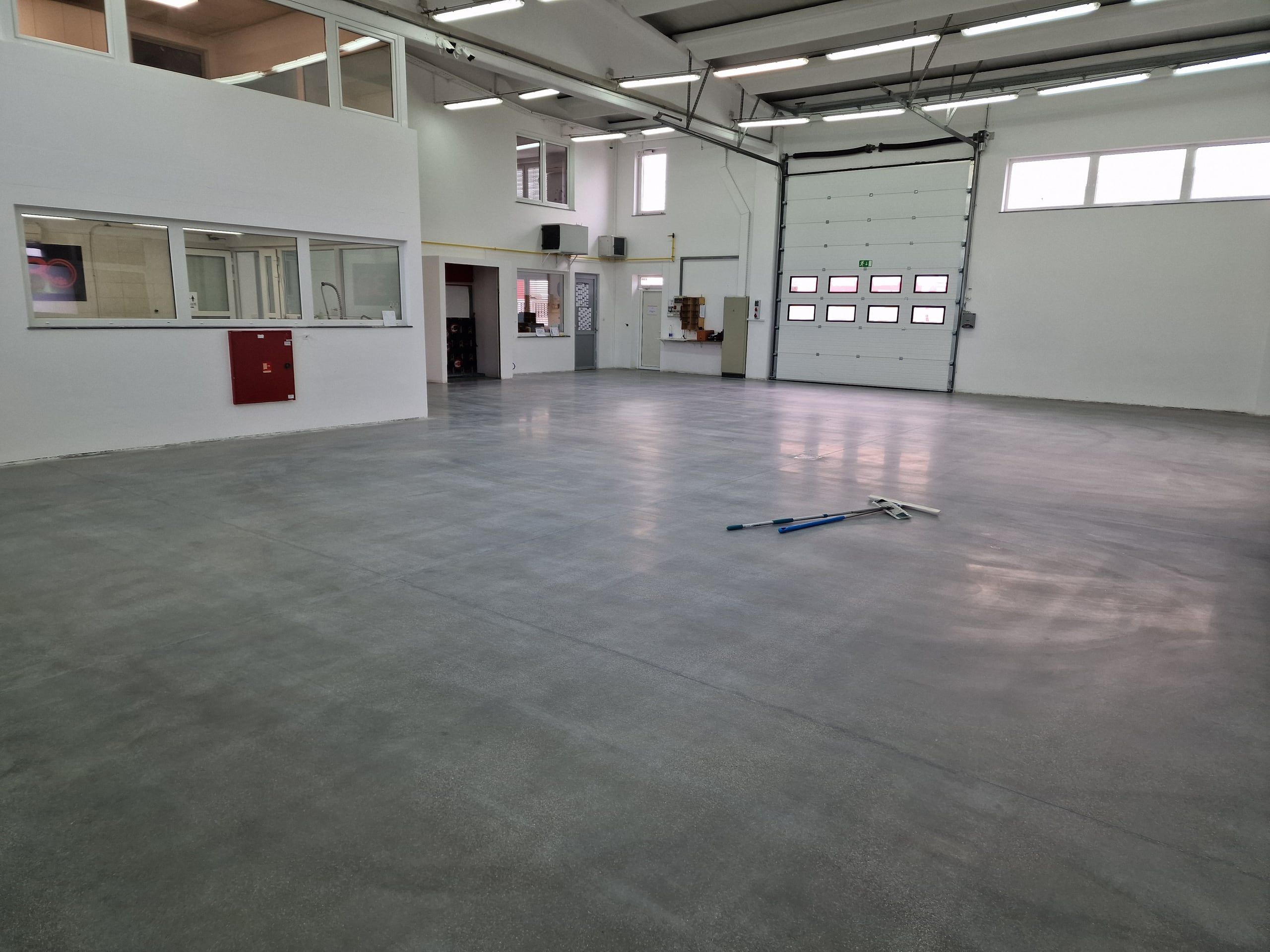 Treated floor in a hall with loading dock doors